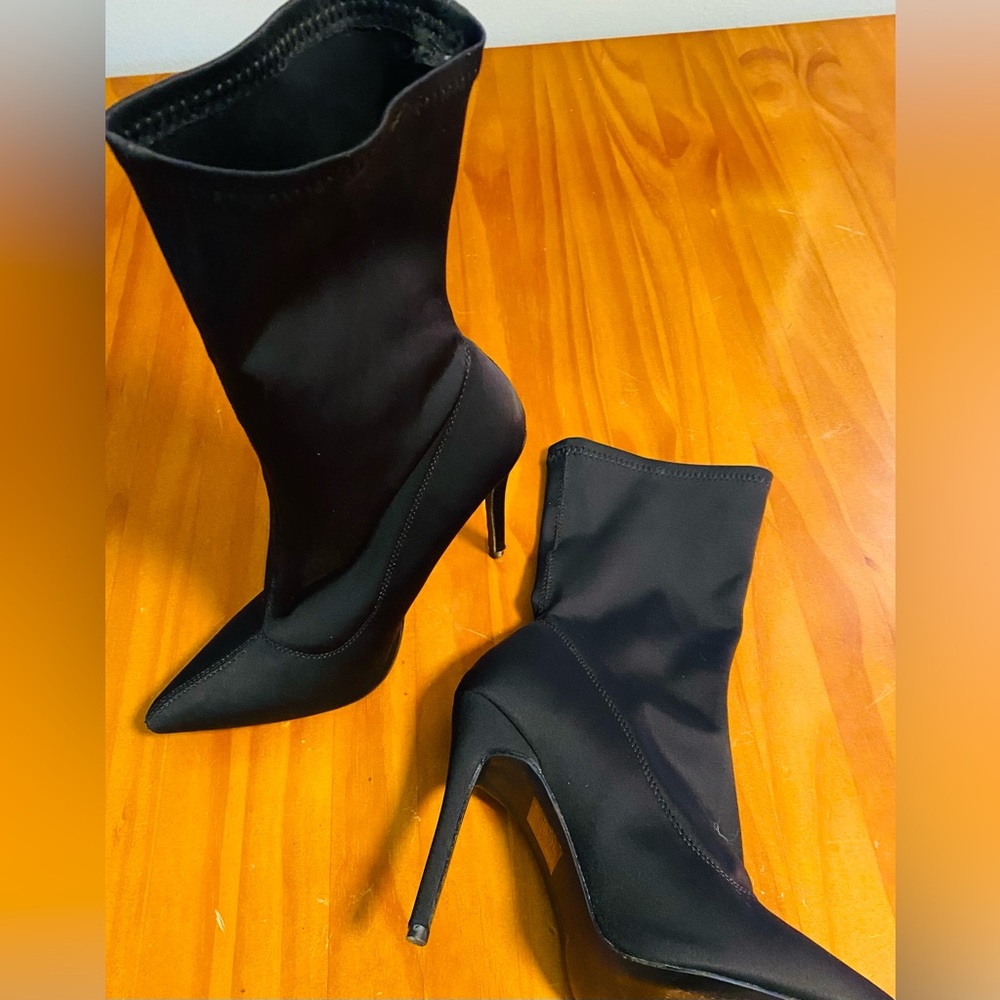 Shin length glove stretch bootie 3 1/2” heel. Never worn